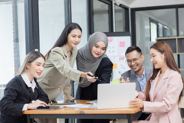 Team of Asian business people and working together in office, Startup projects and business presentation at meeting room.