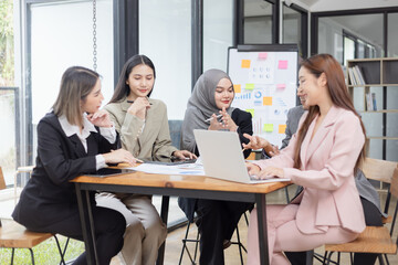 Team of Asian business people and working together in office, Startup projects and business presentation at meeting room.