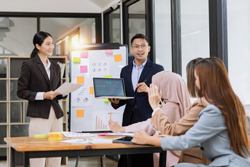 Team of Asian business people and working together in office, Startup projects and business presentation at meeting room.