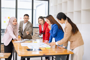 Team of Asian business people and working together in office, Startup projects and business presentation at meeting room, Brainstorming and business,