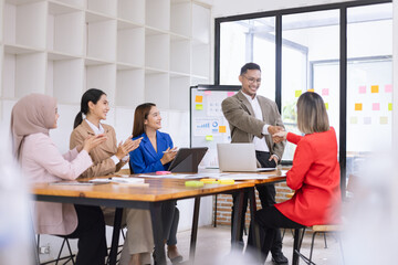 Asian business teamwork making handshake with partner in meeting room, Greeting and corporate business handshake, 