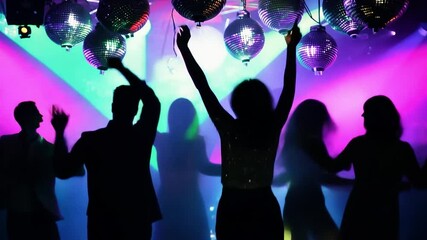 Energetic dancers moving joyfully beneath shimmering disco balls - Powered by Adobe