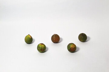 Green lime fruits on isolated white background. Sliced and unsliced.