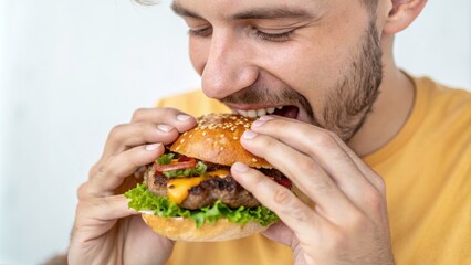 Man enjoying a delicious burger.
