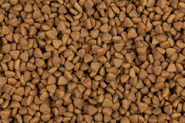 dry pet food background texture. close up. top view