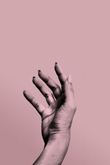 Digital collage hand object to outstretched hand isolated on a pink background