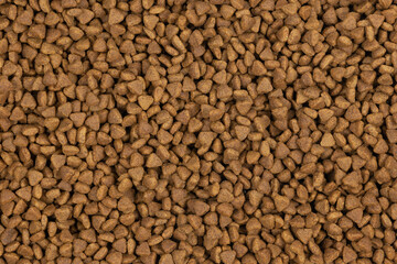 dry pet food background texture. close up. top view
