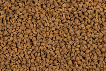 dry pet food background texture. close up. top view