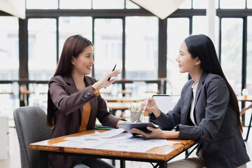 Two businesswoman working with analysis data investment plan, Business startup and marketing presentation,