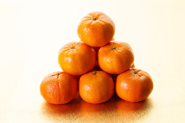 Tangerine oranges on golden background for celebration Lunar New Year