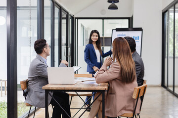 Asian business teamwork working with analysis report and advisor showing plan, Financial analysis and Marketing teamwork concept.