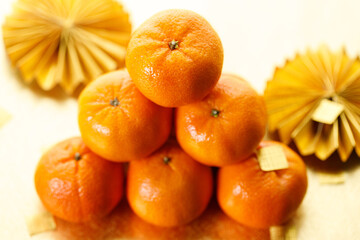 Tangerine oranges on golden background for celebration Lunar New Year