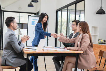 Asian business teamwork working with analysis report and advisor showing plan, Financial analysis and Marketing teamwork concept.