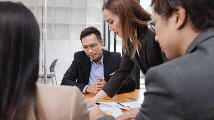 Asian business teamwork working with analysis report and advisor showing plan, Financial analysis...