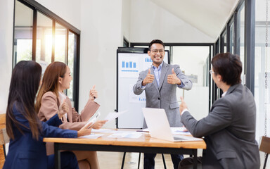 Asian business teamwork working with analysis report and advisor showing plan, Financial analysis and Marketing teamwork concept.