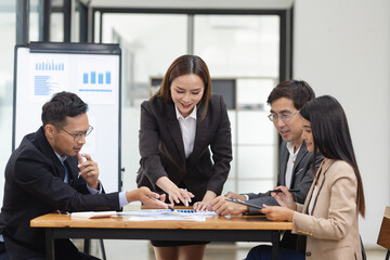 Asian business teamwork working with analysis report and advisor showing plan, Financial analysis and Marketing teamwork concept.