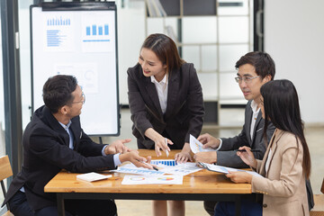 Fototapeta premium Asian business teamwork working with analysis report and advisor showing plan, Financial analysis and Marketing teamwork concept.