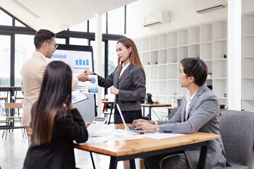 Asian business teamwork working with analysis report and advisor showing plan, Financial analysis and Marketing teamwork concept.