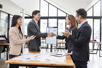 Asian business teamwork working with analysis report and advisor showing plan, Financial analysis and Marketing teamwork concept.