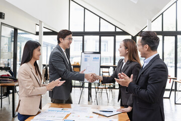 Asian business teamwork working with analysis report and advisor showing plan, Financial analysis and Marketing teamwork concept.