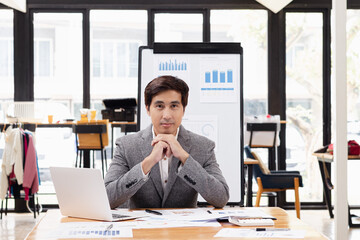 Businessman working with business financing accounting banking and laptop with finances analysis report at desk in office. 
