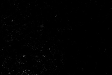 Chaotic white star bokeh on black background. falling blurry bokeh snow overlay, starry sky. white spot and drops. abstraction