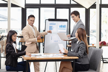 Asian business teamwork working with analysis report and advisor showing plan, Financial analysis and Marketing teamwork concept.