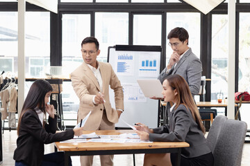 Asian business teamwork working with analysis report and advisor showing plan, Financial analysis and Marketing teamwork concept.