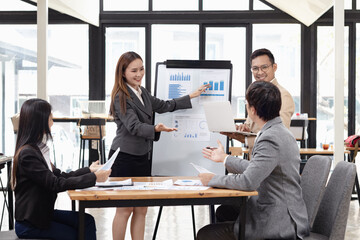 Asian business teamwork working with analysis report and advisor showing plan, Financial analysis and Marketing teamwork concept.