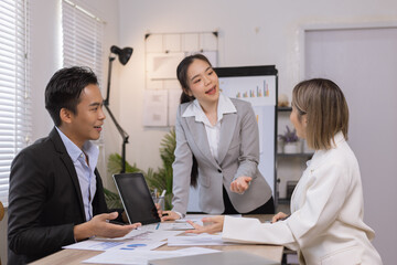 Asian business team working with analysis report and advisor showing plan, Financial analysis and Marketing teamwork concept.