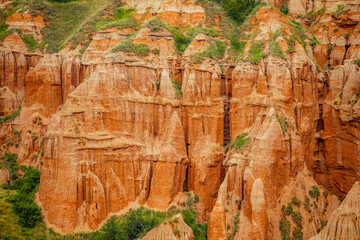 Red rocky slopes Rapa Rosie is a protected geological and floristic reservation area near Sebes alba in Romania