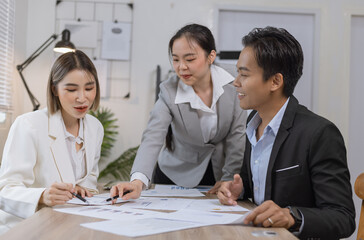 Fototapeta premium Asian business teamwork working on digital tablet with analysis report and advisor showing plan, Financial analysis and Marketing teamwork concept.