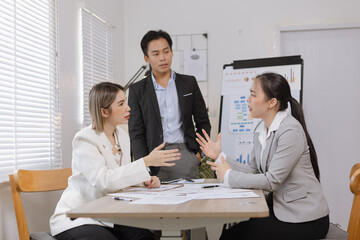 Asian business teamwork working on digital tablet with analysis report and advisor showing plan, Financial analysis and Marketing teamwork concept.