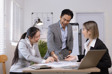 Asian business teamwork working on digital tablet with analysis report and advisor showing plan, Financial analysis and Marketing teamwork concept.