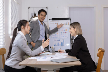 Asian business teamwork working on digital tablet with analysis report and advisor showing plan, Financial analysis and Marketing teamwork concept.