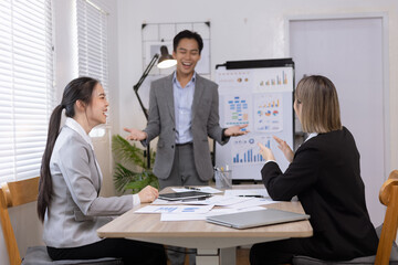 Asian business teamwork working on digital tablet with analysis report and advisor showing plan, Financial analysis and Marketing teamwork concept.