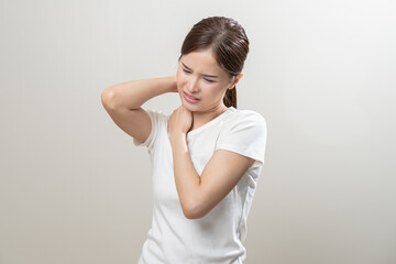 Pain body muscles stiff problem, asian young woman, girl painful with neck pain body ache from work, holding massaging rubbing shoulder hurt, sore on white background. Health care and medicine concept