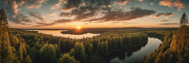 Naklejka premium Aerial forest view near a lake at sunset with Cloudy sky
