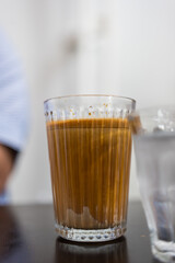 A glass of dirty coffee in coffee shop