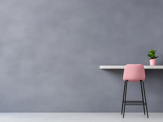 Minimalist home interior design featuring a pink stool and a green plant against a gray wall