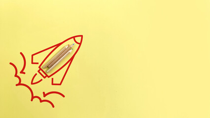 Rocket icon made from school pencils on yellow background. Innovation, creativity and education concept. Back to school. 