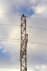 power transmission tower against clouds