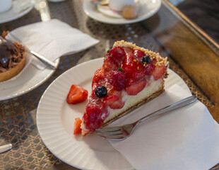 Strawberry cheesecake on a plate, selective focus