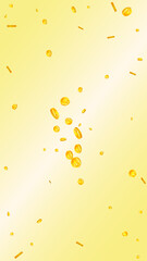 Chinese yuan coins falling. Scattered gold CNY