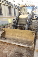 Fototapeta premium excavator loading a truck on the yard 