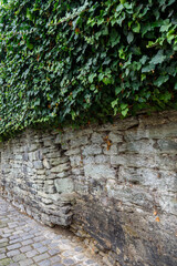 Old stone wall in German town. Walk in Soest, Germany.