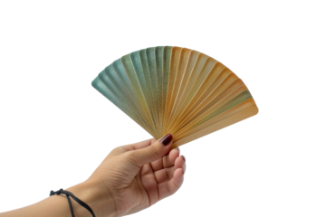 Hand holding fanned playing cards isolated on transparent background for gaming concept