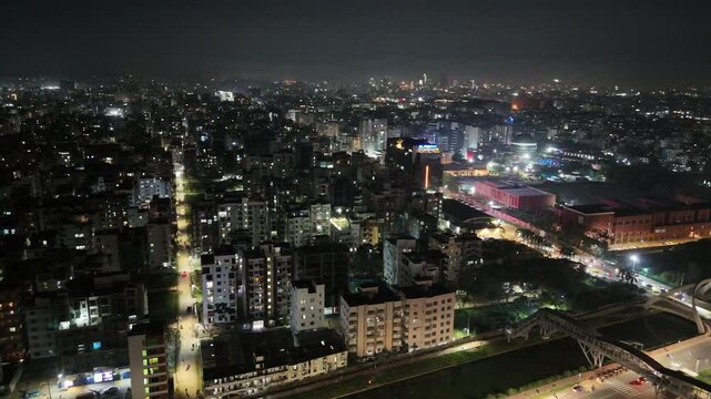Beautiful aerial drone sky shot of night city view of the road stress, Night Scenery, Flyover, and River, which is located in Dhaka Bangladesh