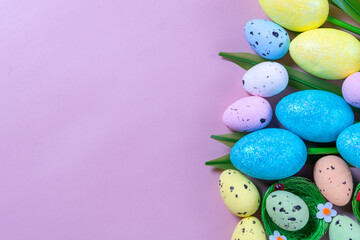 Flowers on purple background. Easter top view postcard with copy space