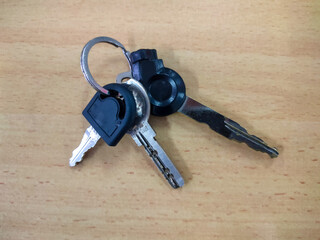 bunch of keys on a wooden background
